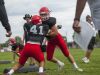 A pair of Big Reds go through a tackling drill Friday, Aug 12, during practice at Port Huron High School.