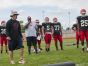 Head coach Ryan Mullins gets his team fired up Friday, Aug 12, during practice at Port Huron High School.