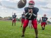 Big Reds' quarterback DeAngielo Sanderson Jr. prepares for a pass Friday, Aug 12, during practice at Port Huron High School.