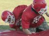 Marlette's Isaac Dale tackles teammate Chorben Chisholm Wednesday, Aug. 10 , 2016 during their football practice at Marlette High School.