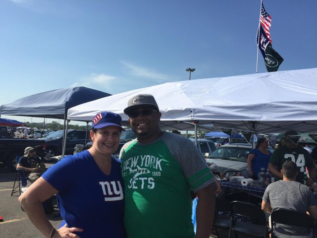 Diana and Ben Scoon, husband and wife from Hamburg, fly a “House Divided” flag over their tailgate at the Jets-Giants preseason game.