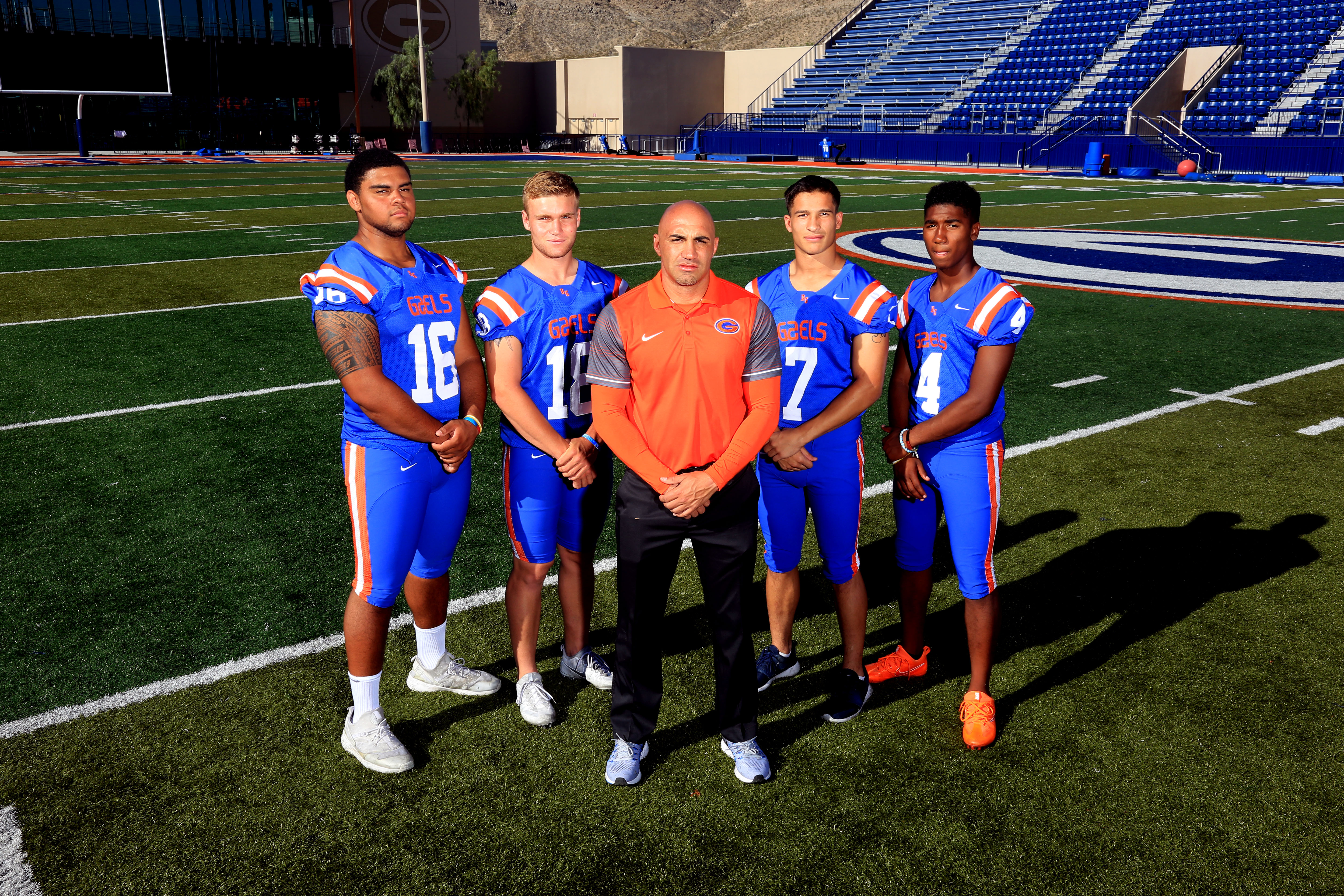 Bishop Gorman coach Kenny Sanchez surrounded by (from left), Haskell Garrett, Tate Martell, Biaggio Ali Walsh and Alex Perry (Photo: Greg Cava)
