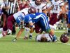 Fort Defiance's Austin Fitzwater is tackled with the football as the helmet comes off Stuarts Draft's Dalton McGann during a football game played in Fort Defiance on Friday, Sept. 2, 2016.