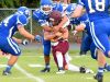 Stuarts Draft quarterback Garrett Campbell is wrapped up by Fort Defiance's Miguel Garcia during a football game played in Fort Defiance on Friday, Sept. 2, 2016.