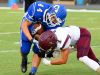 Fort Defiance's Austin Fitzwater holds onto the football as Stuarts Draft's Robert Peck slams into him for the tackle during a football game played in Fort Defiance on Friday, Sept. 2, 2016.