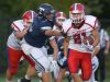 Fairport's Dom Gombetto, right, eludes Webster Thomas' Tyler Curtis on his way to scoring the Raiders' third touchdown.