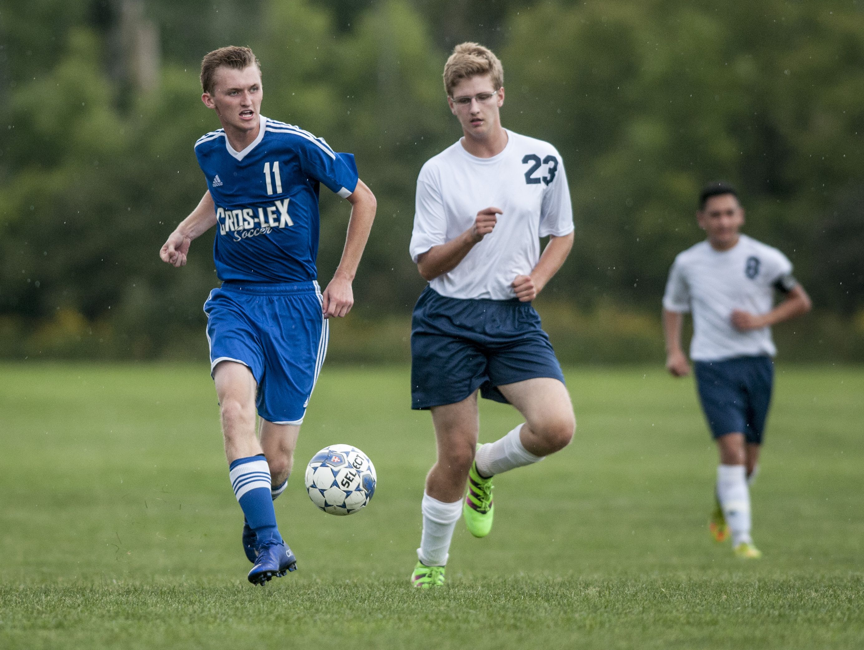 Cros-Lex's Hunter Rankin passes the ball in front of Capac's Austin Lowien during a soccer game Wednesday, September 7, 2016 at Capac High School.