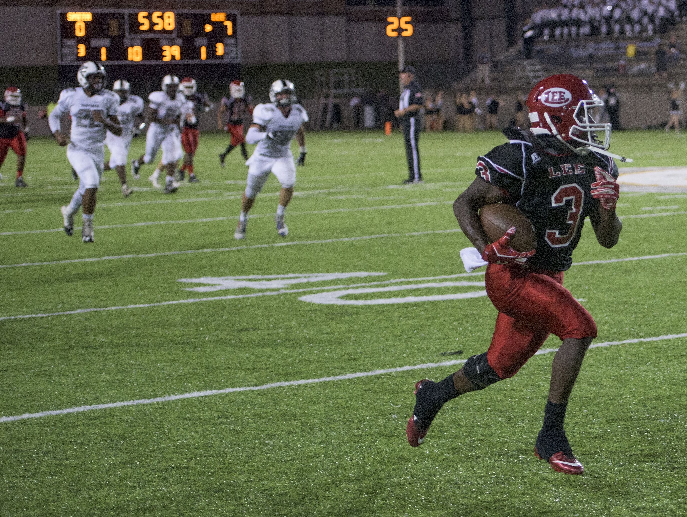 Lee's Kaniaus Johnson breaks free for a long first half touchdown against Smith's Station at Cramton Bowl in Montgomery, Ala., on Thursday September 8, 2016.