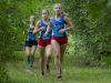 St. Clair's Morgan Markel leads a pack including her teammate Gabrielle Morton, right, Saturday, Sept. 10 at the Algonac Muskrat Cross Country Classic at Algonac High School. Markel finished second with a time of 20:18 and Morton finished first with a time of 20:12