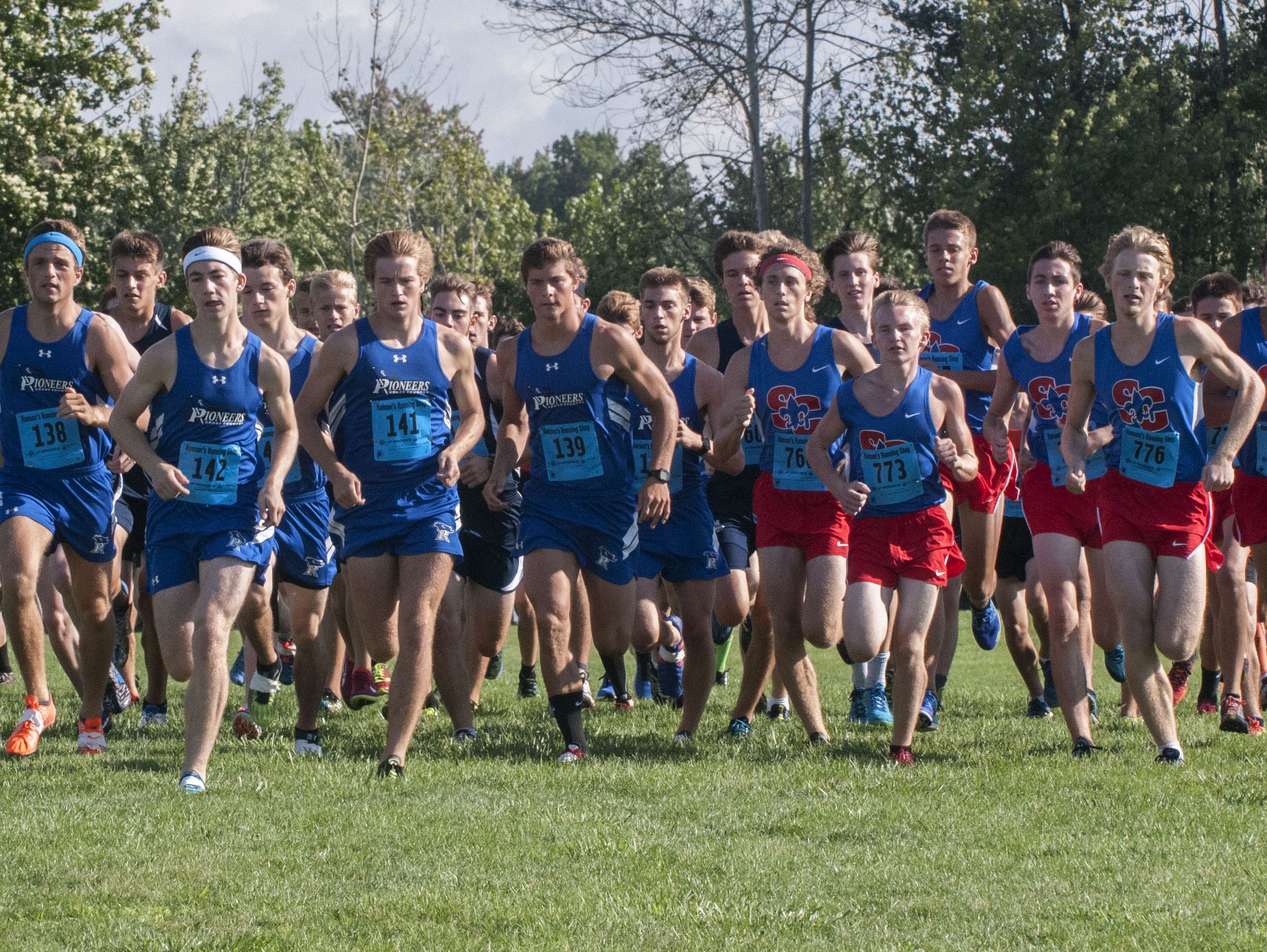 CrosLex and St. Clair runners lead the beginning of the Division 2-3-4 race Saturday, Sept. 10 at the Algonac Muskrat Cross Country Classic at Algonac High School.