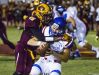 Mountain Pointe High School's Jacob Olsen tackles Chandler High's Jacob Conover for a big loss during first half action at Mountain Pointe on Thursday night.
