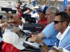 Scouts use radar guns to determine pitch speed during the Perfect Game Invitational Baseball Tournament at the East Cobb Baseball Complex in Marietta, Ga. July 11, 2011. Thousands of the best high school baseball players in the nation gathered for two weeks to play games in front of college and professional scouts in the hope of receiving scholarships to colleges or being pursued major league organizations. ( Seth Harrison / The Journal News )