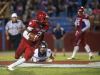 Pine Forest High running back Jaden Gardner, (No.2), slips away from the Gulf Breeze Line backer, Ben Dobry,(No. 11) during Friday night's home game against the Dolphins.