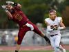 The ball slips through the hands of Roosevelt's Carter Carstens during a pass while Harrisburg's Brock Harris chases after during their game on Friday at Howard Wood Field.