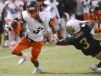 Javian Hawkins of Viera is dragged down by William Champion of Viera during Friday's game in Viera.