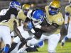 Heritage High's Willie Gaines is taken down by Osceola High's Mario Kendricks.