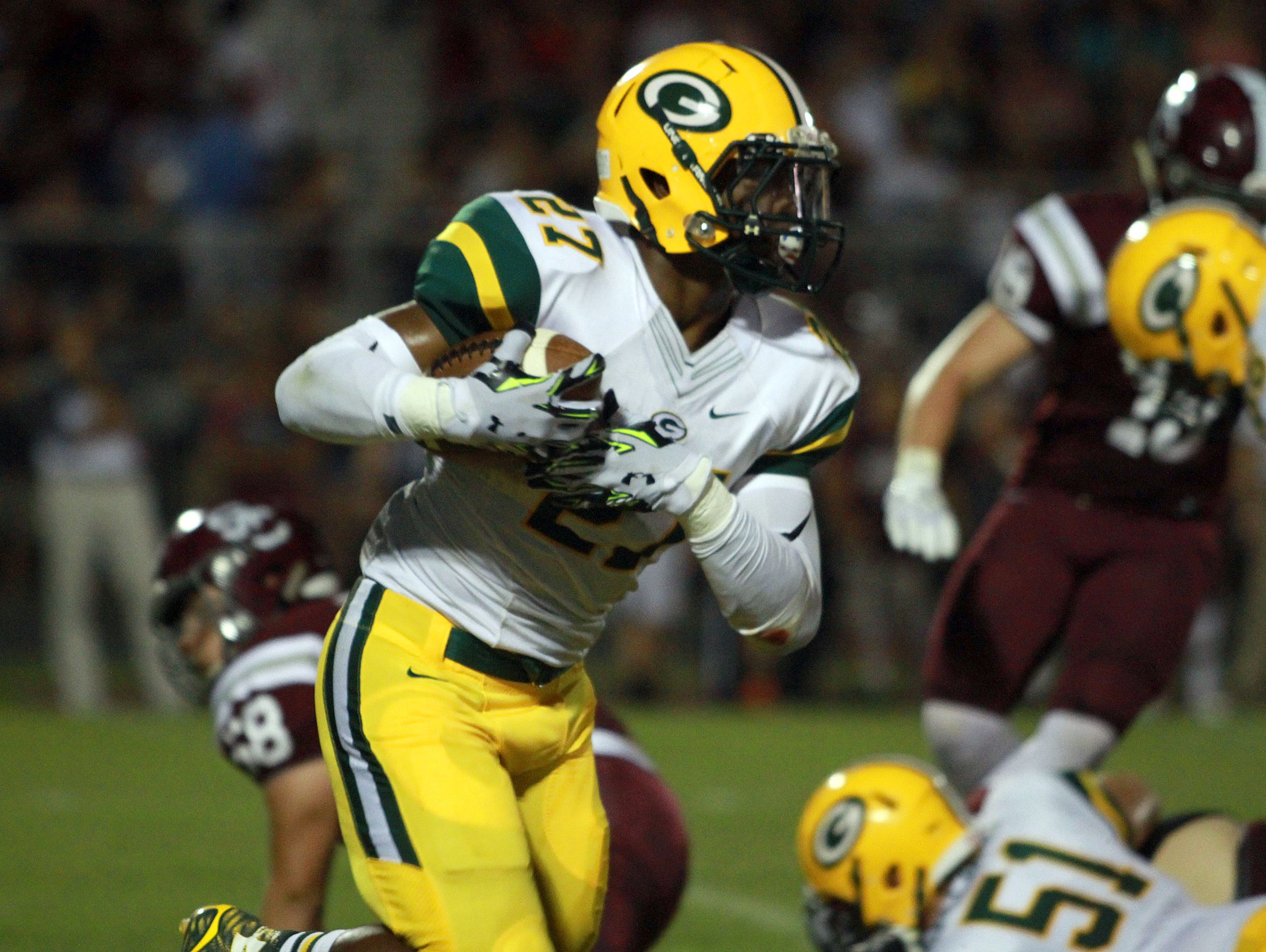 Gallatin running back Jordan Mason rushes against Station Camp during Friday's game. Mason rushed for 298 yards and three touchdowns on 40 carries in the Green Wave's 34-27 victory.