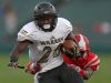 Warren Central Warriors running back Jason Holland (20) is tackled by Pike Red Devils cornerback Zane Greene (9) during first half action of the Gridiron Classic at Victory Field, Indianapolis, Friday, September 23, 2016.