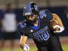 Cathedral City High School's Isaac Reyes runs for yardage against Shadow Hills High School at home.