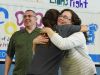 Kristen Perry, center, a physical education teacher and the field hockey coach at John Jay High School, gives a hug to Jeanmarie Craane, right. The school's field hockey team "adopted" Craane's son Liam, 5, who is battling pediatric cancer, through the Friends of Jaclyn Foundation.