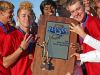 FILE – North Central boys tennis players celebrate their third straight state championship, Oct. 17, 2015.