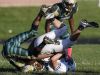 Crispus Attucks's Kei-Juan Hawkins (82) tackles Bishiop Chatard's Patrick Mastrian (85) on Sept. 26, 2016.