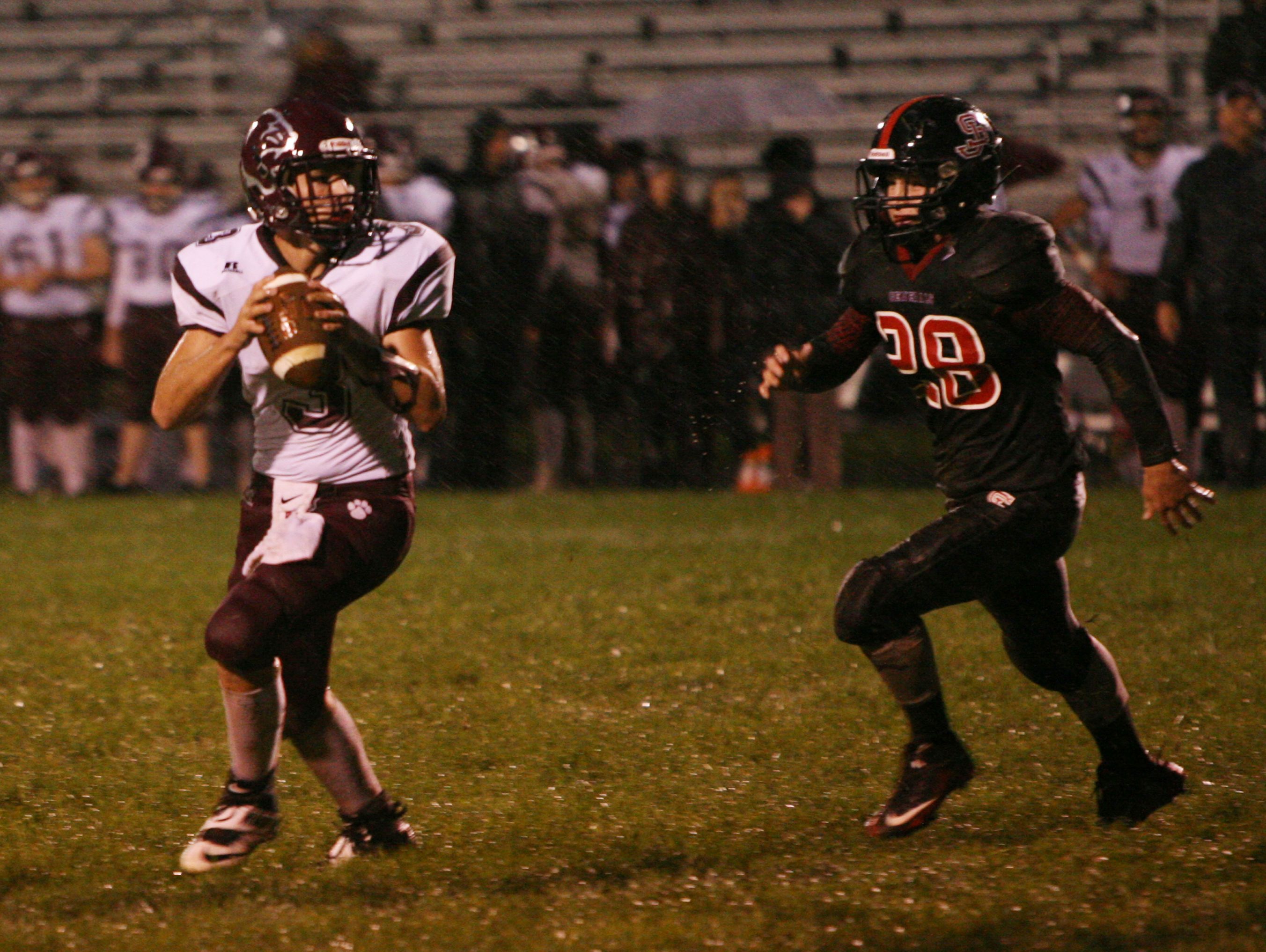 Stonewall Jackson's Dylan Vann goes after Stuarts Draft quarterback Garrett Campbell during the first half of Friday night's game against Stonewall Jackson in Quicksburg on Sept. 30, 2016.