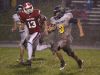 Pewamo-Westphalia quarterback Ryan Smith, right, runs for a touchdown on a keeper against Laingsburg's Jordan Jones (13) Friday, Sept. 30, 2016, in Laingsburg, Mich.