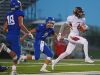 Madison's Mason Leighton (4) carries the ball into the end zone after catching a pass during a game against Sioux Falls Christian Friday, Sept. 30, 2016, at Bob Young Field in Sioux Falls.