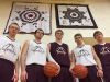Hinsdale senior boys’ basketball players Brett Johnson (left to right), Kyle Albus, Lukas Johnson, Dallas Capdeville and Wyatt Pattison pose in front of star quilts hung in the Hinsdale High gymnasium honoring would-be seniors Garrett Younkin and Justin Leatherberry, who were killed in separate car crashes.