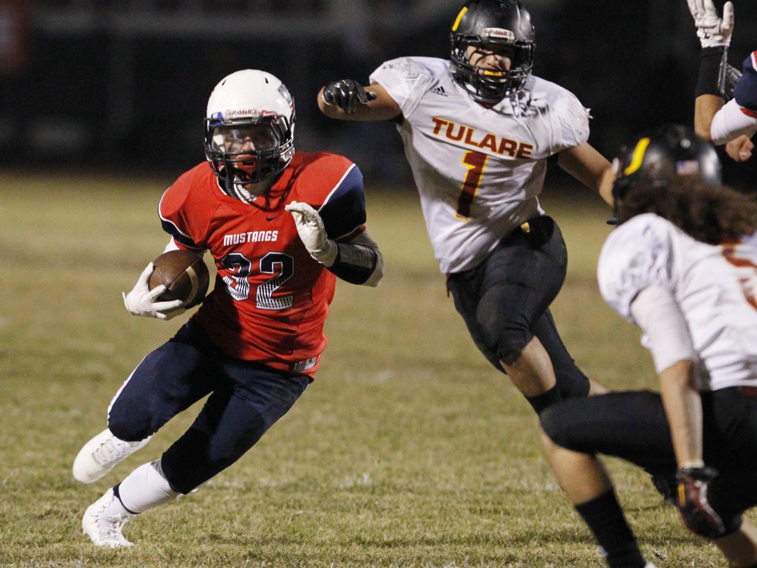 Tulare Western’s Mason Berrnardo looks for running room against Tulare Union during the Bell Game on Nov. 6. Tulare Western and Tulare Union have playoff games tonight. Tulare Union hosts Sunnyside, and Tulare Western is at Tehachapi.