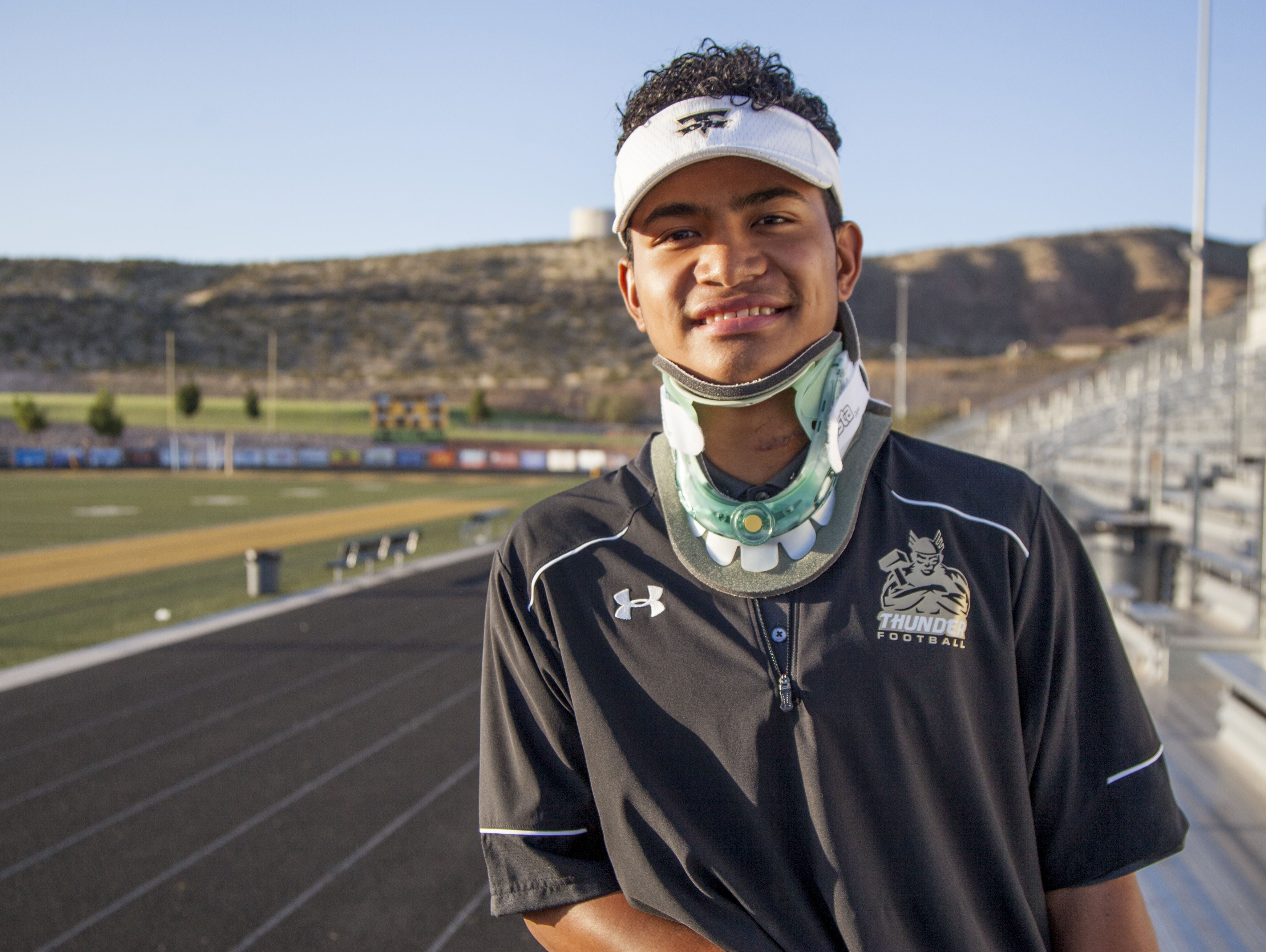 Desert Hills' Nephi Sewell begins the long road to recovery after his season was cut short by a spinal injury sustained during their game against Jordan High. Friday, Sept. 4, 2015.