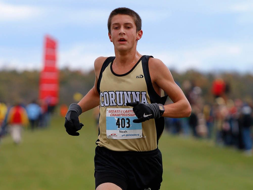 Corunna's Noah Jacobs approaches the finish all alone to win the Greater Lansing Cross Country Championships last season. Jacobs owns the area's fastest time this fall and is regarded as one of the nation's top runners.