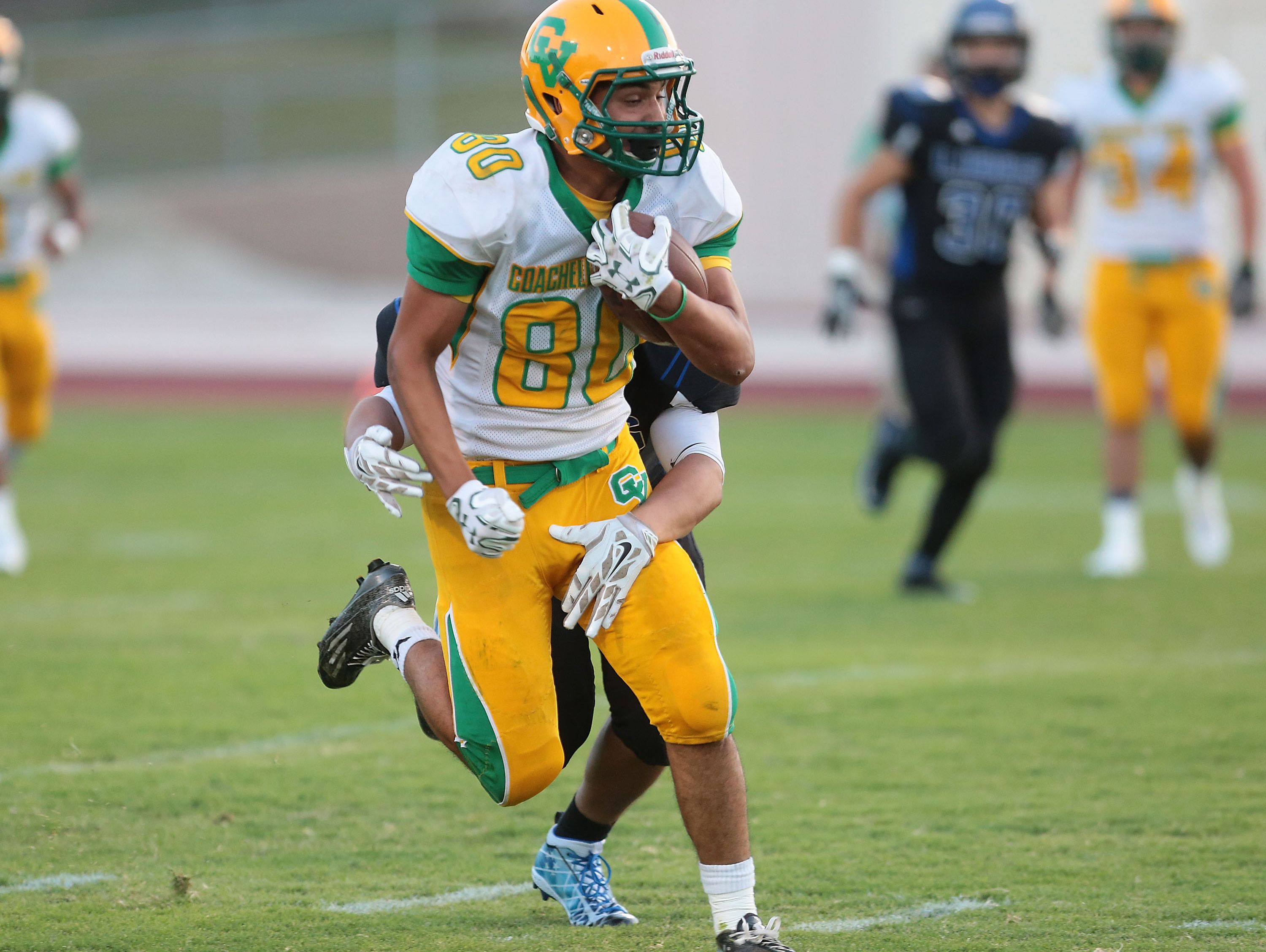 Jacob Salazar picks up a first down for Coachella Valley against Cathedral City, August 26, 2016.