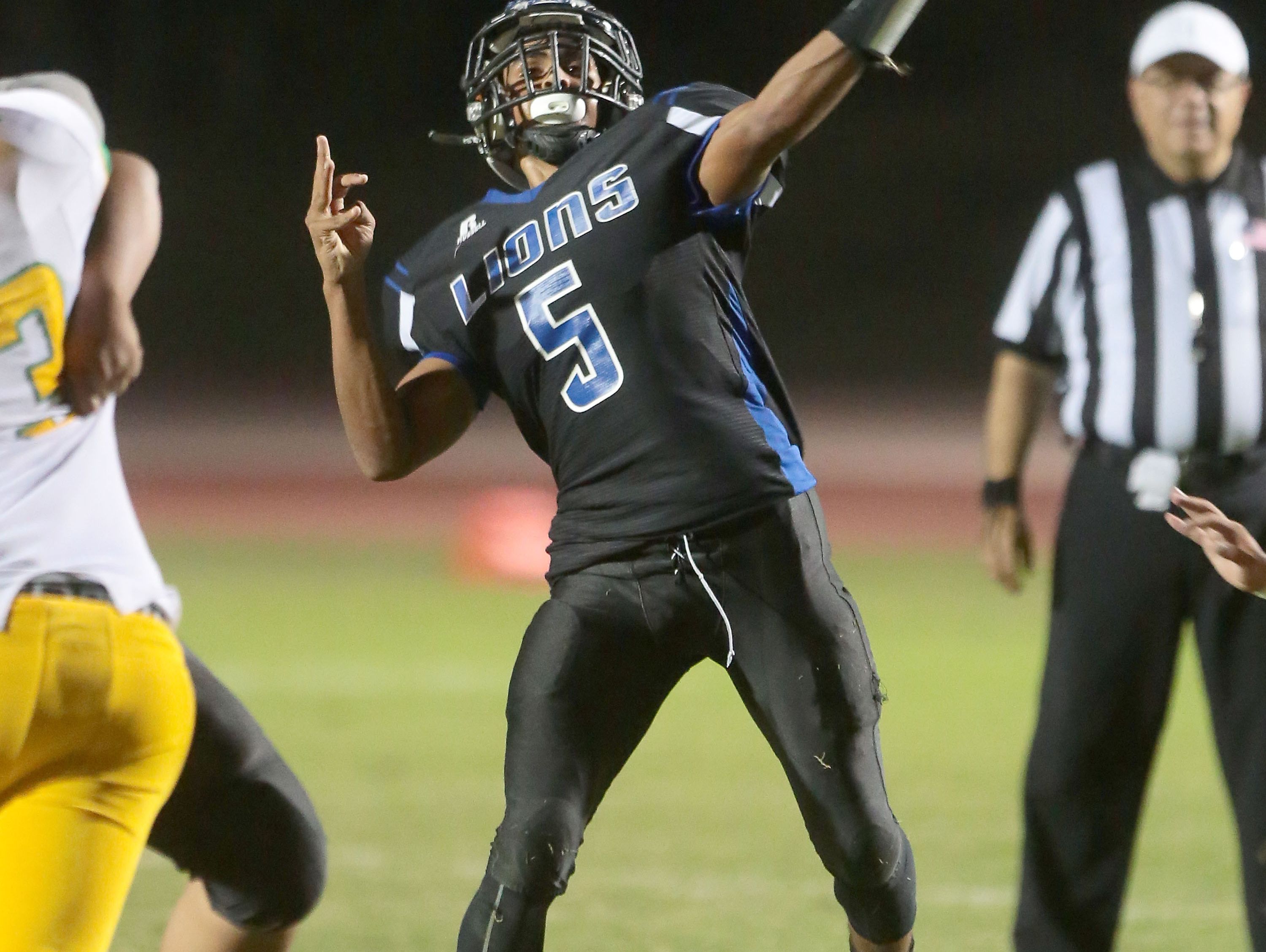 Cathedral City quarterback Jordan Wallace throws against Coachella Valley, August 26, 2016.