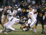 Victor running back Mitchell Spindler (24) leaps over Pittsford's Frankie Imburgia (5) in Week 3. Next for the Blue Devils is Fairport, another undefeated opponent Victor faces at home.