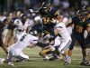 Victor running back Mitchell Spindler (24) leaps over Pittsford's Frankie Imburgia (5) in Week 3. Next for the Blue Devils is Fairport, another undefeated opponent Victor faces at home.