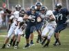 Marysville senior Dante Chrcek runs the ball and breaks through a host of Marine City defenders during a football game Friday, September 16, 2016 at Marysville High School.