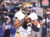 Brentwood quarterback Carson Shacklett rolls out before finding an open receiver at Dickson County. Friday, Sept. 16, 2016, in Dickson, Tennessee.