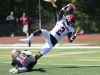 Stepinac's Atrilleon Williams (2) dives into the end zone while being hit by Iona's Michael Degasparis (10) for his first touchdown of the game, during football action at Iona Prep in New Rochelle Sept. 17, 2016. Stepinac won the game 42-34.