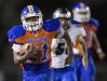 Cape Coral High School's Isaac Washington breaks free from Ida Baker defenders during second quarter play Friday at Cape Coral High School in Fort Myers.