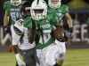 Yasias Young of Fort Myers is chased by Lehigh's Arthur Nance on Friday night at Fort Myers High School.