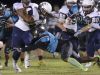 Eau Gallie's Keith Headd runs the ball and Bayside's Derrin Chandler tries to stop him during Friday's game against Bayside.