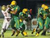 Catholic's Tiamanta Purifoy (22) scores in the first half as Blake Brazwell blocks a Florida High defender. Catholic's Justin Massey (55) leads the way.