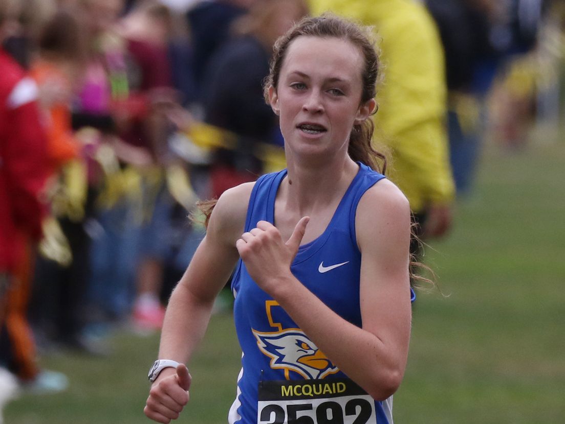 Madeleine Shellard of Irondequoit High School comes in first in the Girls Unseeded Varsity AA, medium and large schools during the 52nd McQuaid Invitational at Genesee Valley Park.