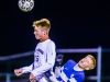Grand Ledge's Aric Phinney, right, and East Lansing's Andrew Person collide during the CAAC Gold Cup final last year. Grand Ledge is the Gold Cup top seed and East Lansing is the No. 4 seed this fall.