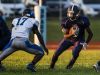 Lake Forest's Nicholas Lane (right) looks for room to run past Woodbridge's Leah Styles (left) in the first quarter of Woodbridge's 32-0 win over Lake Forest at Lake Forest High School in Felton on Monday evening.