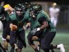 Birmingham Groves' Beau Kewley hands off to Ernest Allen against Rochester Adams on Friday, Oct. 7, 2016 at Birmingham Groves High School in Beverly Hills, MI.