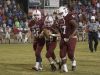 Jake Henry (16) hands off to honorary football player Markus Baxley(26), a student with cerebral palsy, as teammates Dylan Foxhall (22) and Evan Allen (57) carry him to a touchdown prior to the game against Pace High School in Pensacola on Friday, October 7, 2016.