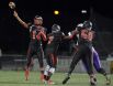 Wilson quarterback James Cotton throws a long pass at Rhinos Stadium on Friday, Oct. 7, 2016.